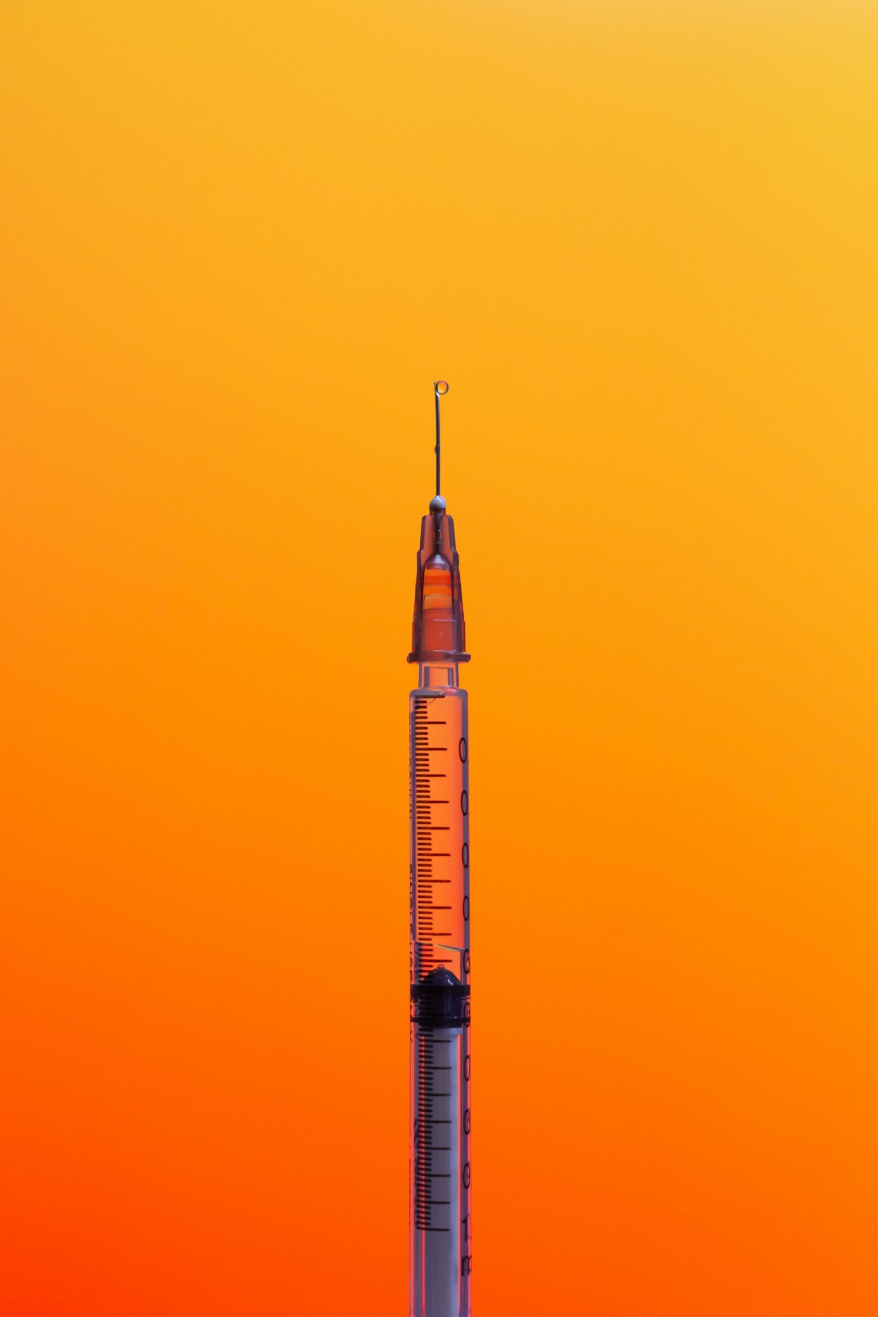 needle against sunburst background