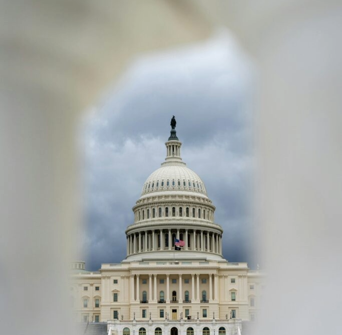 dome of the US capitol building, ringed in haze