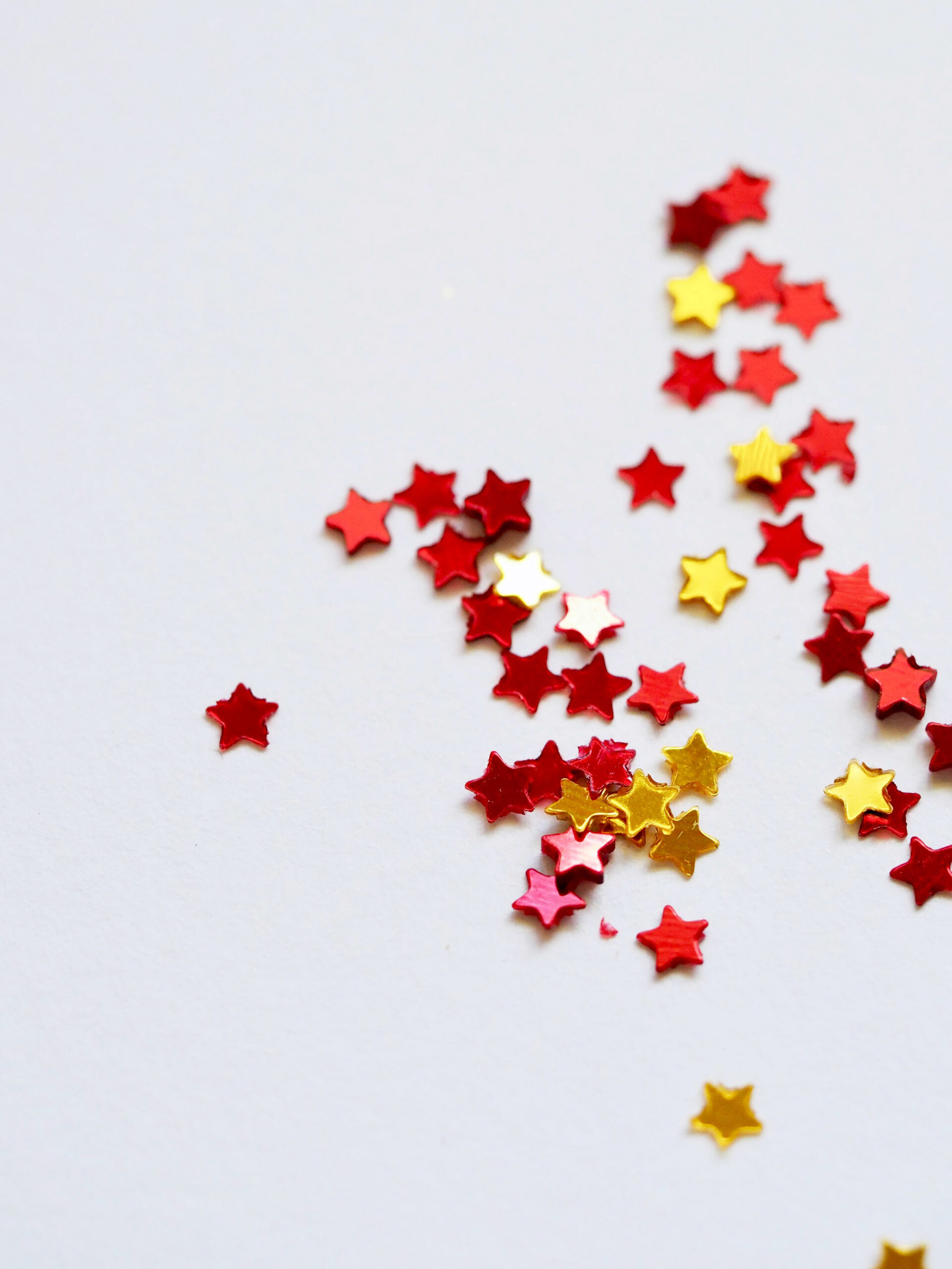 red and yellow and orange stars on a white background
