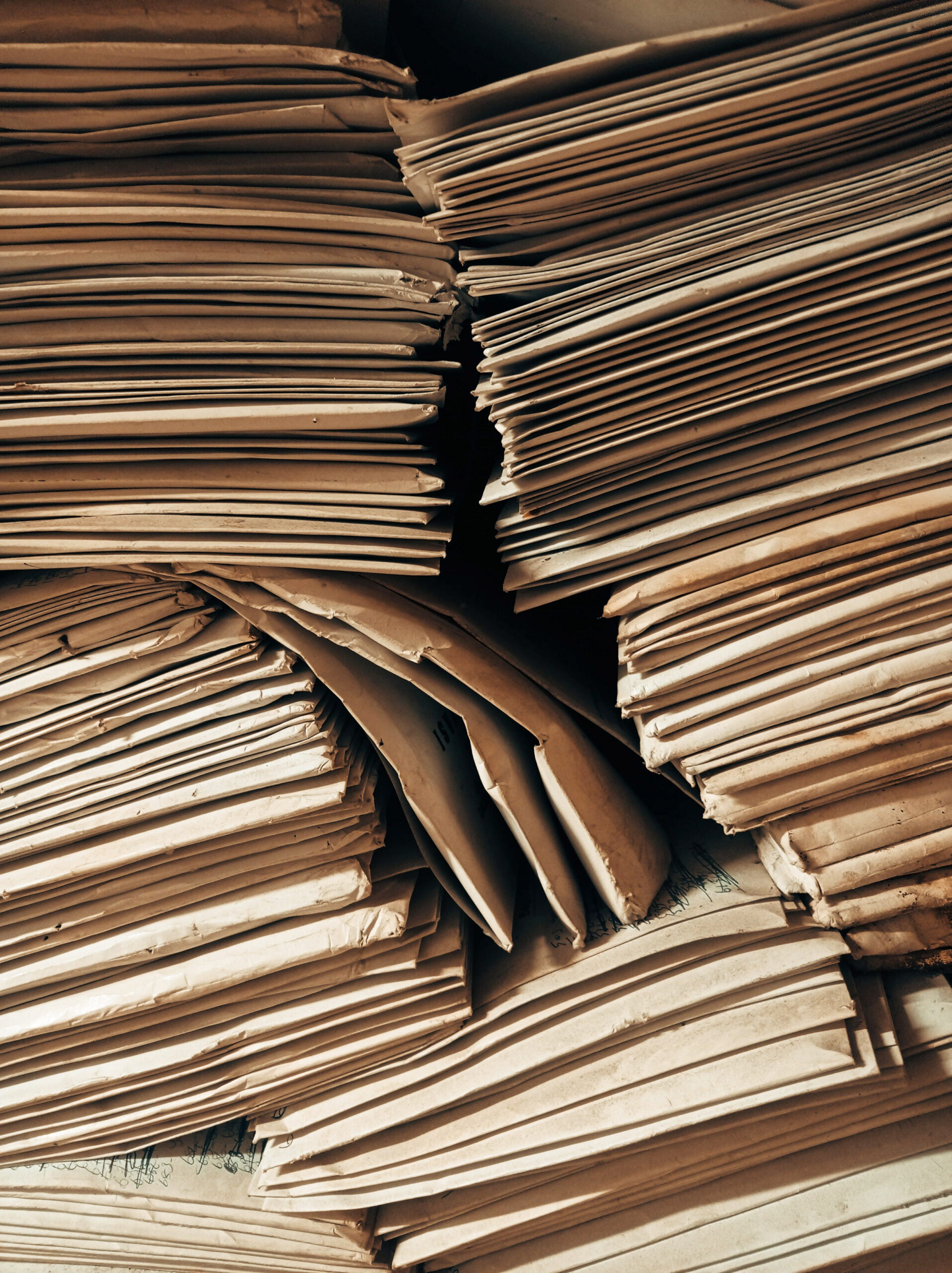a stack of brown envelopes