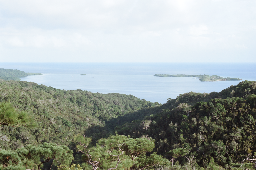 view of mountains in fore with sea 