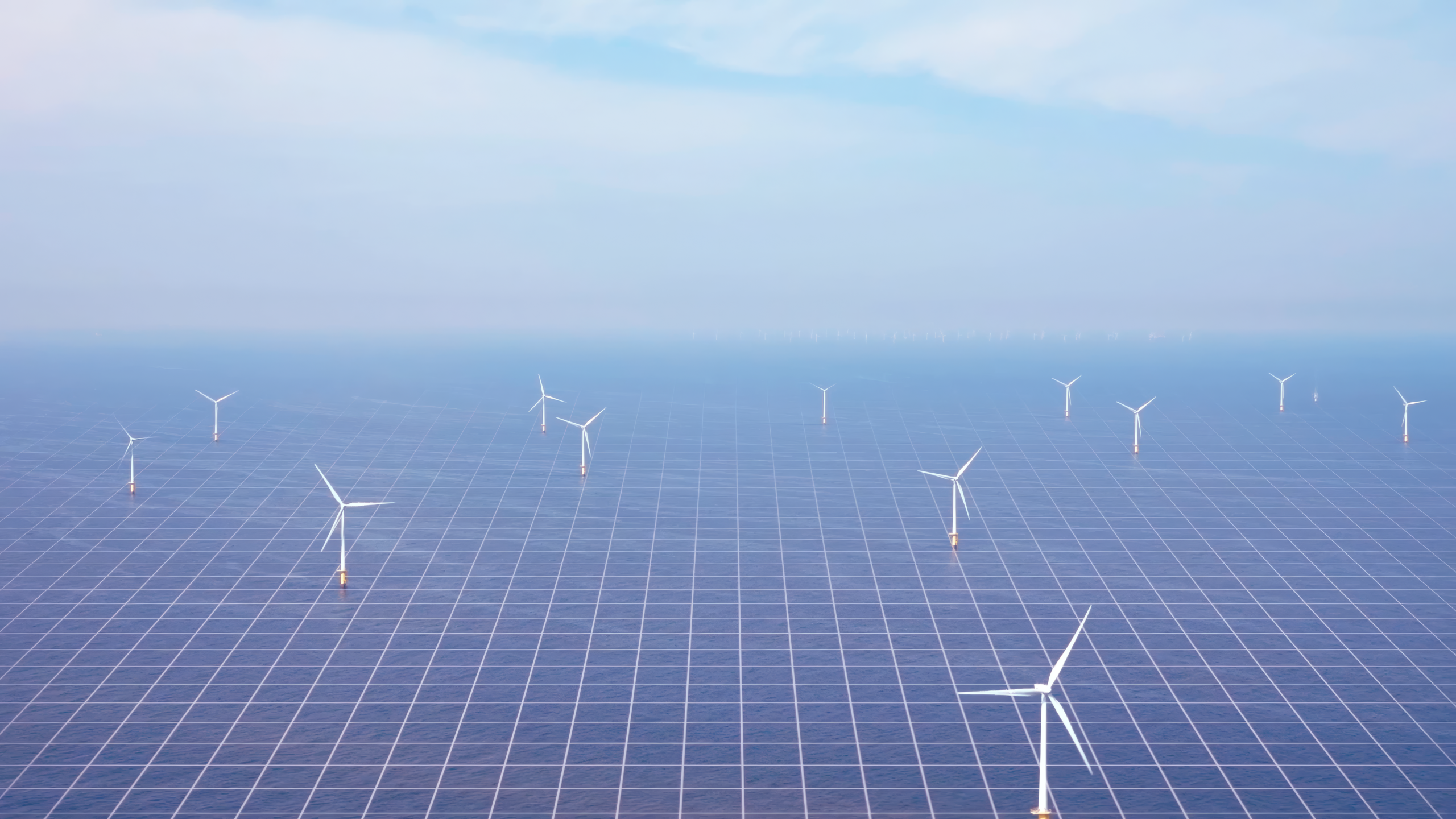 Digital image of sea as seen from above with wind turbines. The sea is marked with grid lines.