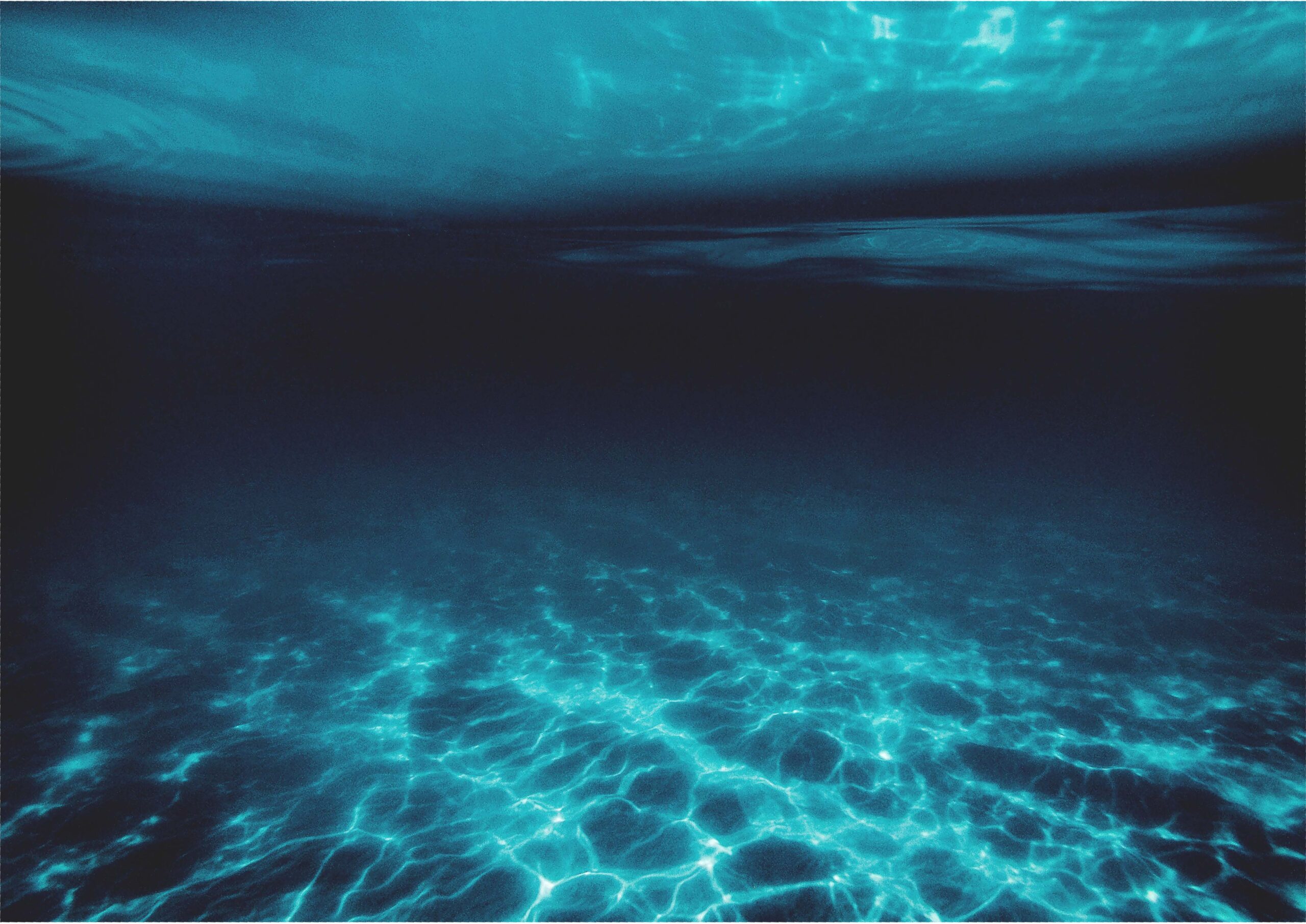 photo of underwater scene, blue with sunlight shining through