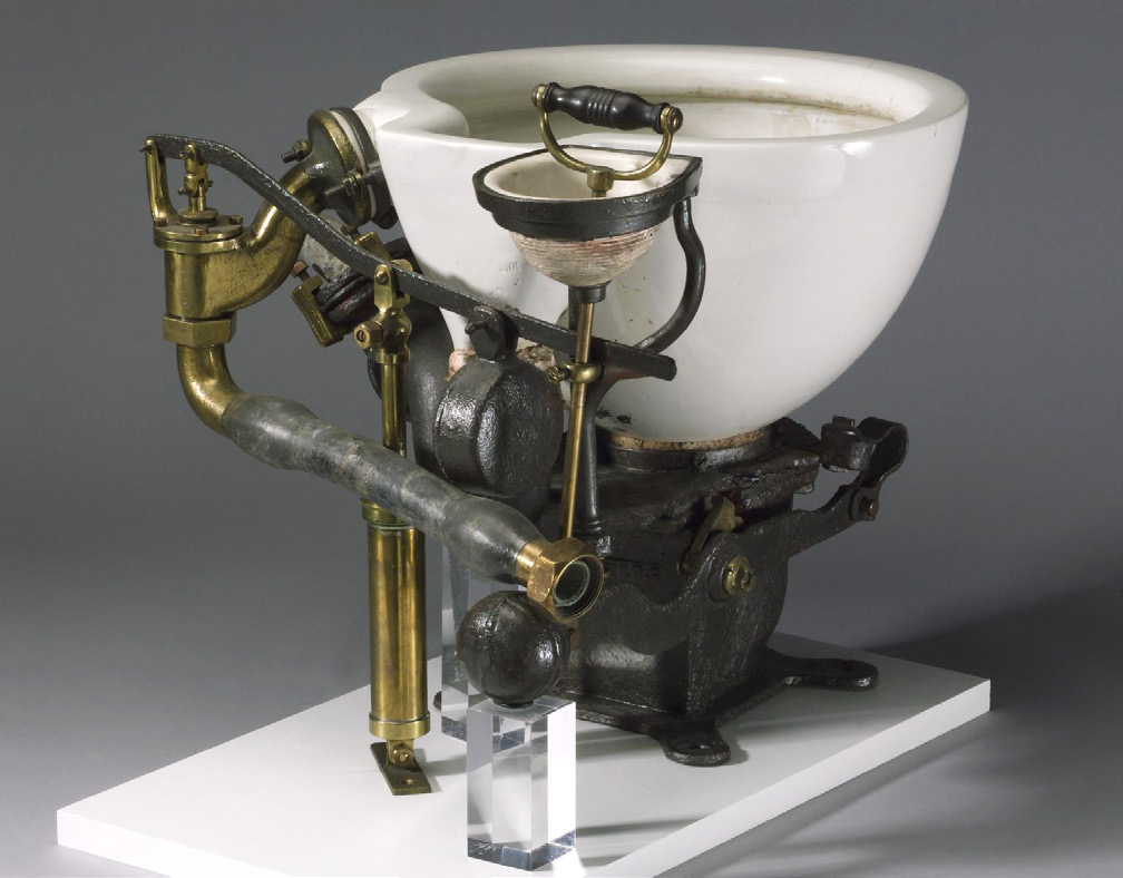 1870's toilet with plumbing hardware showing