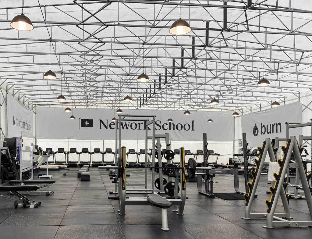 A bright white and gray corporate-looking gym